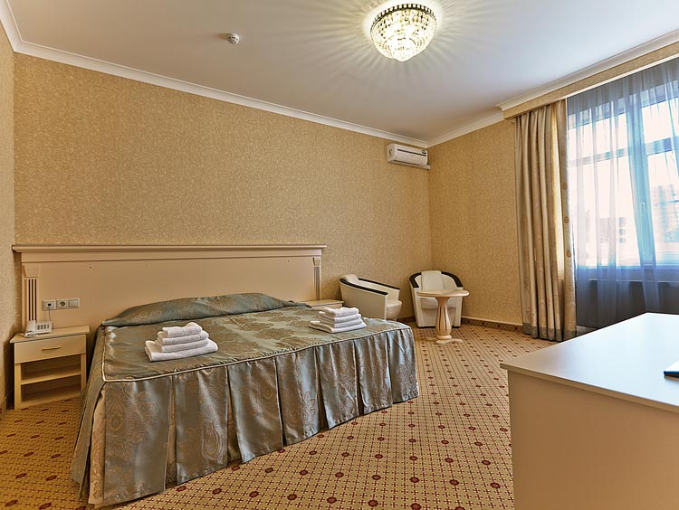 спальня в номере Люкс в гостинице Триумф в Краснодаре